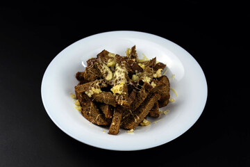Homemade black bread croutons with garlic and cheese