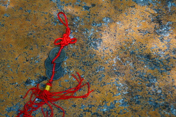 Chinese Feng Shui coin on a concrete wall.