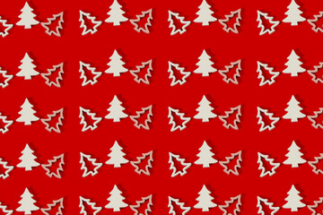 Christmas Pattern. Repetition of the silhouette of a white Christmas tree on a red background. Merry Christmas background. Horizontal.