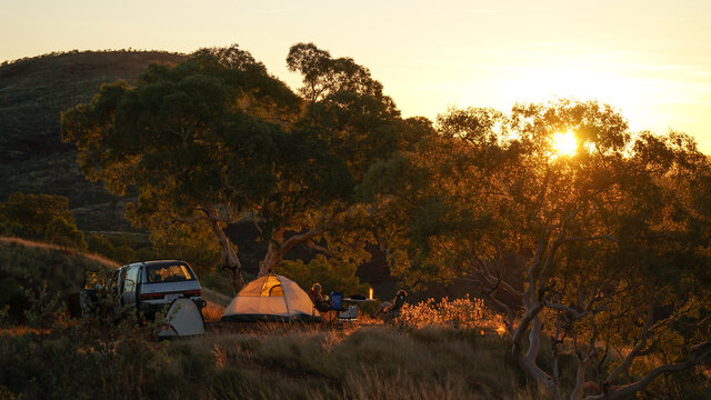 Hiking and camping in the hilly landscapes near Dales Gorge and Karijini National Park in Western Australia.