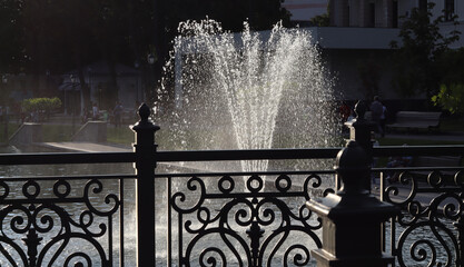 image of a fountain in a summer city park