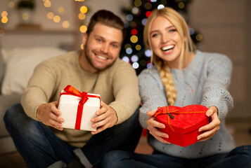 Happy couple celebrating Christmas together at home