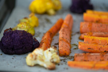 Grilled carrots and cauliflower with aromatic herbs and olive oil.  Mediterranean diet.