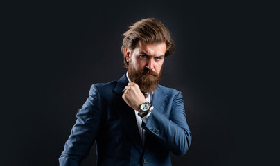 what time is it. male beauty and fashion. brutal businessman with perfect beard and moustache. real...
