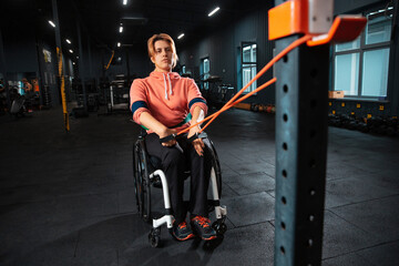 Stretching. Disabled woman training in the gym of rehabilitation center, practicing. Active woman with handicap. Concept of healthy lifestyle, motivation, concentration, inclusion and diversity.