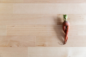 funny looking carrot on a board