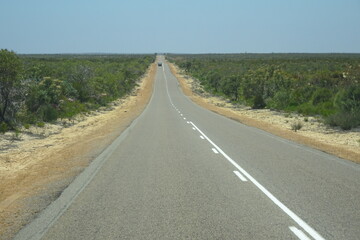 Driving through Western Australia on straight road for miles