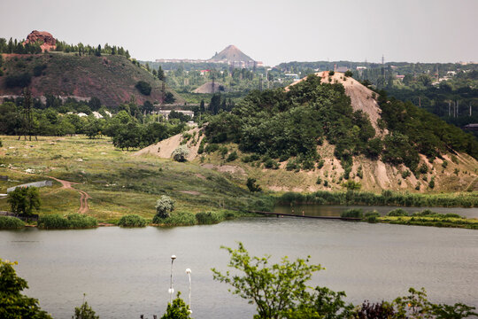 View to large waste heap of coal mine and Kalmius river in Donetsk, Ukraine. June 2012