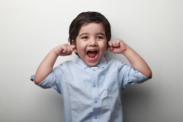 Cute little boy screaming out of excitement