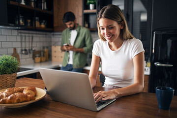 Attractive lady working on laptop