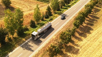 Tank truck and car on the road, aerial photography
