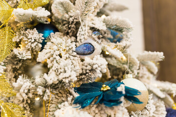 Christmas tree with colorful baubles. Holidays and decor concept.