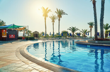 Pool and poolside of hotel on tropical resort