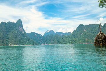 mountains lake river sky and natural attractions in Ratchaprapha Dam at Khao Sok National Park, Surat Thani Province, Thailand.