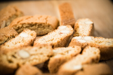 Top view of tasty Italian cantuccini on wooden table. Selective Focus.