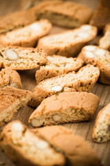 Top view of tasty Italian cantuccini on wooden table. Selective Focus.