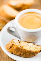 Close up of fresh made espresso cup with cantuccini. Top view. Selective focus.