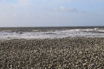 The deserted, stormy, wintry beach at Dyffryn Ardudwy, Wales, UK.