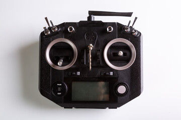 Black remote control for drone. Top view on white background. Horizontal orientation. High quality photo