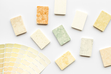Choosing flooring and furniture materials samples with color scheme. Top view