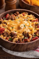 Bowl of chili mac with cheddar cheese
