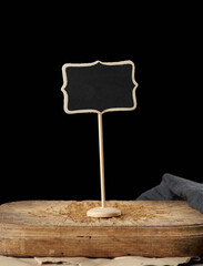 wooden pointer on a stick for writing text, black background