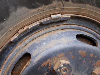 Lead weight on old car rims. Lead-weighted wheel balancing for vehicle wheel balance while in use...