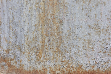 old rusty texture of cracked white paint The old cracked paint on a wall surface