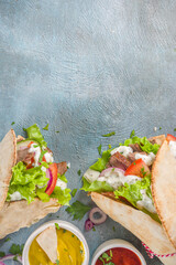 Turkish kebab wrap shawarma  sandwiches. Tasty fresh wrap sandwiches with beef meat and vegetables, Traditional Middle Eastern snack.