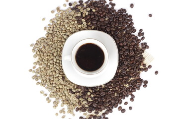 Black coffee is served in a glass cup, which is placed on top of the coffee beans which are arranged neatly to form a heart.