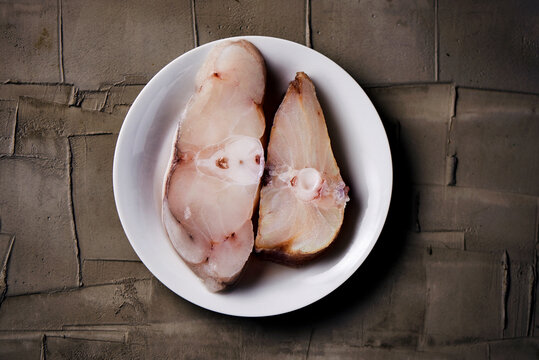 slices of raw monkfish in a plate