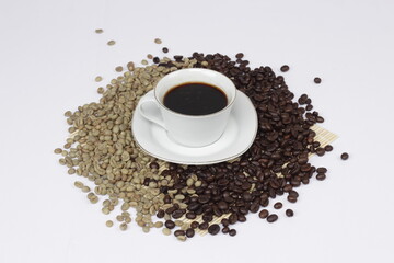 Serving black coffee on a white background, sprinkled with coffee beans.
