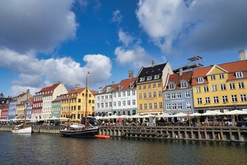 Obraz premium Copenhagen, Europe, colored houses in Nyhavn, promenade blue sky