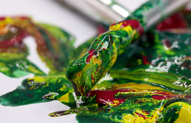 close-up brush and paint on colored background