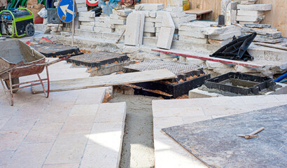 Worker inserts fiber optic cables buried in a micro trench