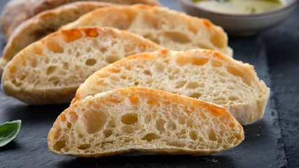 Fotobehang Homemade italian ciabatta bread with olive oil. © Natallia