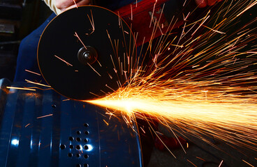 worker cutting steel