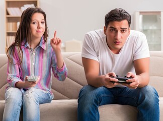 Young family suffering from computer games addiction