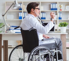 Disabled doctor on wheelchair working in hospital