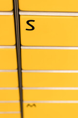 Post office box. Yellow post box for rentals.