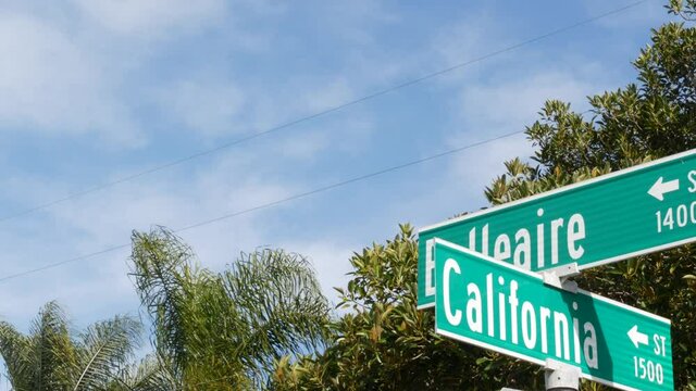 California street road sign on crossroad. Lettering on intersection signpost, symbol of summertime travel and vacations. USA tourist destination. Text on nameboard in city near Los Angeles, route 101.