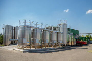 Big stainless steel reservoirs for the fermentation of wine.
