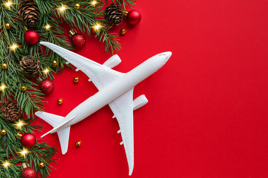 The plane symbolizes the gift of travel.  Christmas travel concept. Christmas background on the theme of travel. Holiday