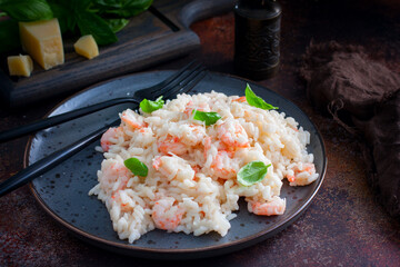 Shrimp risotto with cream sauce, selective focus