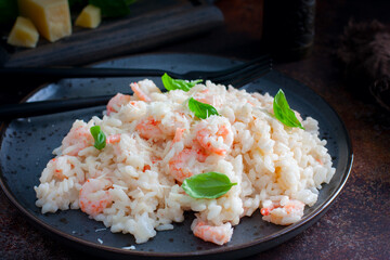 Shrimp risotto with cream sauce, selective focus