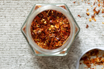 Dried hot chili peppers oriental spices close-up, top view