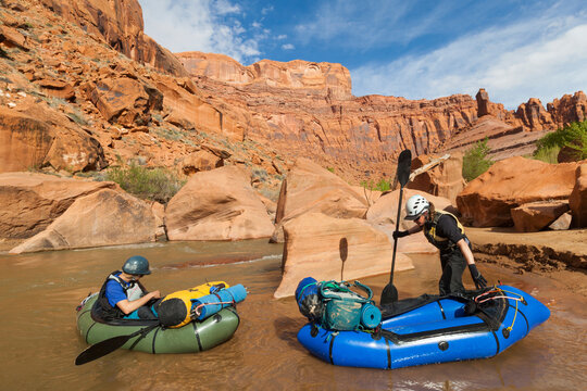 People get into packrafts on Escalante River, Utah