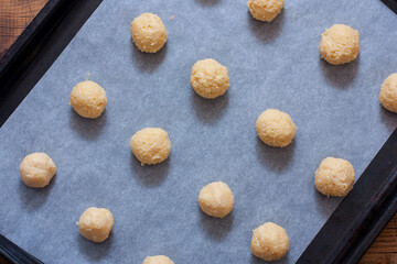 Cooking oven-baked cheese balls step by step, step 4 - forming the balls before baking, horizontal
