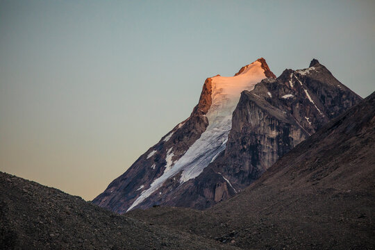Alpenglow on glaciated mountain, Auyuittuq National Park