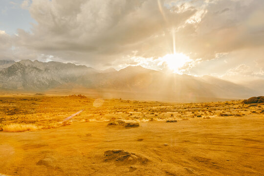 Rays of sunshine near foothills of Alabama Hills during sunset.